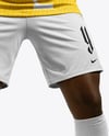 Soccer Player Wearing Jersey and Shorts Holds Cup Mockup