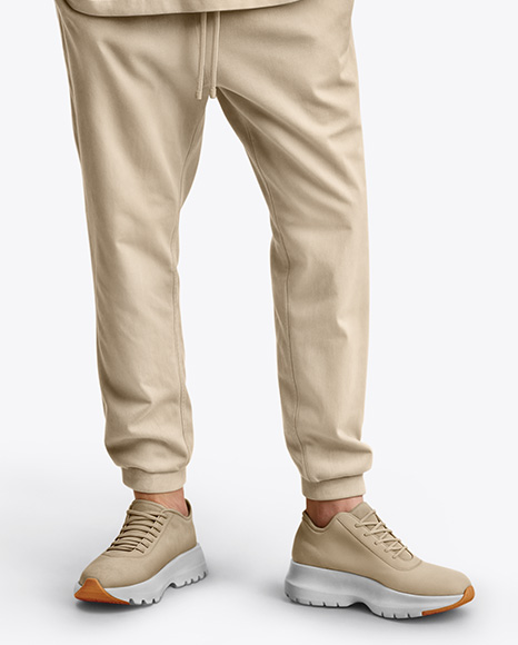 Man Wearing an Oversize T-shirt and Sweatpants Mockup
