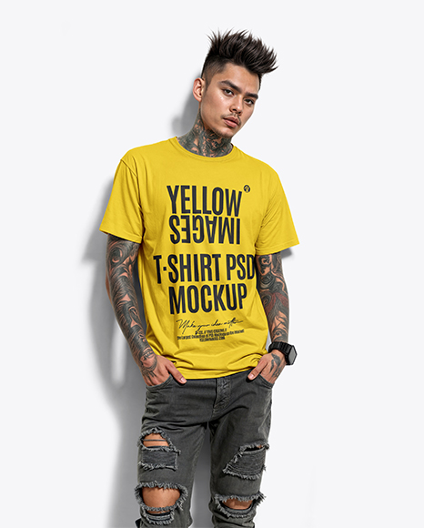 Young Man with Tattoo Wearing T-shirt and Ripped Jeans Mockup - Jeans mockup