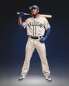 Black Man Wearing a Full Baseball Kit with Bat Mockup