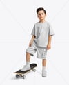 Boy Wearing T-Shirt and Cargo Shorts with Skateboard Mockup