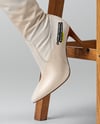 Pair of Over-The-Knee Boots on Women's Legs on Stool Mockup