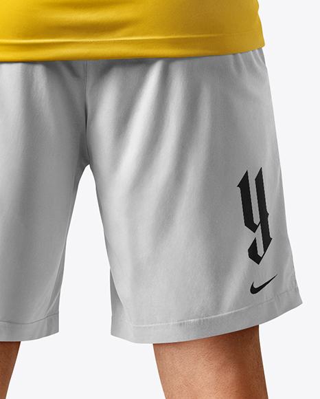 Man Wearing Soccer Jersey and Shorts Mockup