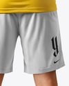 Man Wearing Soccer Jersey and Shorts Mockup