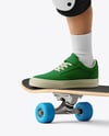 Boy Wearing T-Shirt and Shorts with Skateboard Mockup