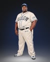 Black Man Wearing a Full Baseball Kit Mockup