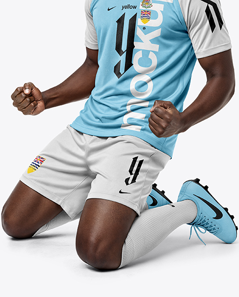Soccer Player Wearing Raglan Jersey and Shorts Mockup