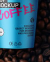 9oz Paper Cup on a Stack of Coffee Beans Mockup
