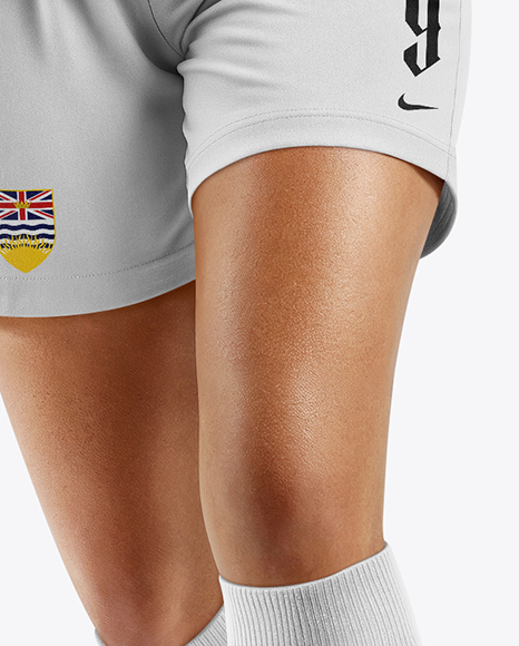 Female Soccer Player Wearing Jersey and Shorts Mockup