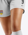 Female Soccer Player Wearing Jersey and Shorts Mockup