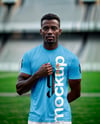 Soccer Player Wearing a Crew Neck Jersey and Shorts at the Stadium Mockup