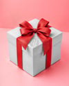 Gift Box with Red Bow on Pink Background Mockup