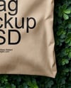 Tote Bag on a Green Leafy Background Mockup
