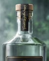 Dry Gin Bottle Surrounded by Forest Mockup