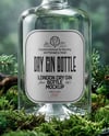 Dry Gin Bottle Surrounded by Forest Mockup