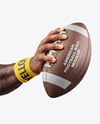 American Football Ball in a Hand Mockup