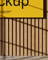 Billboard on a Wall with Wooden Slats Mockup