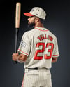 Afro-American Baseball Player Wearing a Jersey and Cap Holding a Bat Mockup
