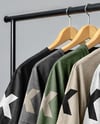 Five T-Shirts on a Wooden Hanger Against a Plain Background Mockup