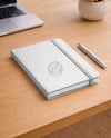 Notebook with Pen on the Table Mockup