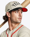 Baseball Player Wearing a Jersey and Cap with a Bat Mockup