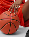 Female Basketball Player Wearing V-Neck Jersey and Shorts Mockup