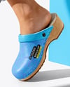Pair of Clogs on Woman's Legs Sitting on Block Mockup