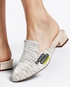 Pair of Suede Mules on Woman's Legs Mockup
