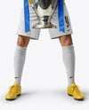Man Wearing Soccer Jersey and Shorts Holds Cup Mockup