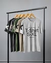 Five T-Shirts on a Wooden Hanger Against a Plain Background Mockup