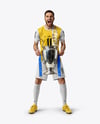 Man Wearing Soccer Jersey and Shorts Holds Cup Mockup