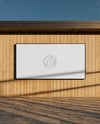 Billboard on a Wall with Wooden Slats Mockup