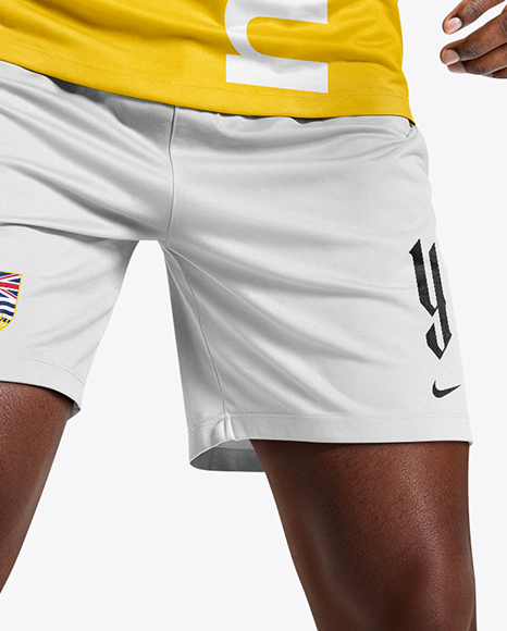 Soccer Player Wearing Raglan Jersey and Shorts Mockup