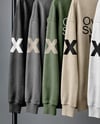 Five Sweatshirts on a Black Rack Against a Plain Background Mockup