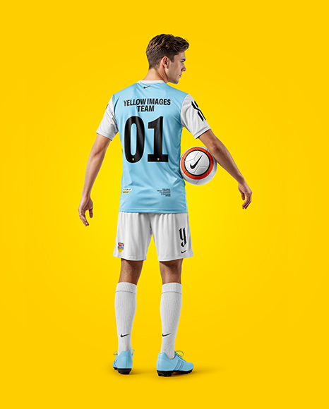 Man Wearing Soccer Jersey and Shorts Mockup