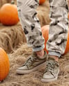 Young Woman in Sweatshirt and Joggers Standing on Hay Block at Pumpkin Patch Mockup