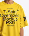 Man Wearing Oversized T-Shirt and Sun Visor Mockup