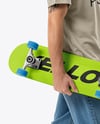 Young Man Wearing T-Shirt and Beanie Hat Holding Skateboard Mockup