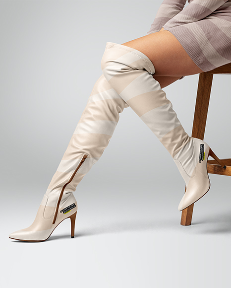 Pair of Over-The-Knee Boots on Women's Legs on Stool Mockup