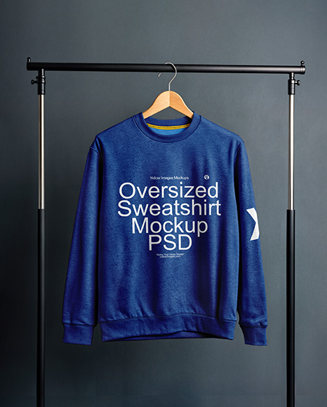 Sweatshirt on a Wooden Hanger Against a Plain Background Mockup