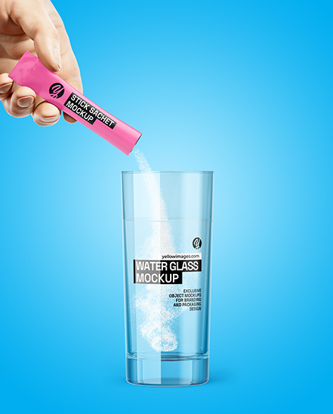 Matte Stick Sachet With Powder in a Hand & Water Glass Mockup