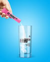 Matte Stick Sachet With Powder in a Hand & Water Glass Mockup