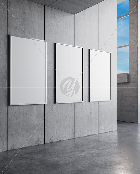 Three Framed Posters on Concrete Wall Mockup