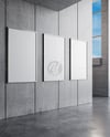 Three Framed Posters on Concrete Wall Mockup
