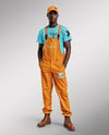 Black Man Wearing a Bib Overalls and T-Shirt Mockup