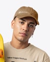 Young Man Wearing T-Shirt and Holding Skateboard Mockup
