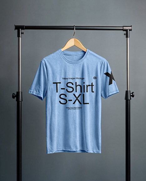 T-Shirt on a Wooden Hanger Against a Plain Background Mockup - T-shirt mockup
