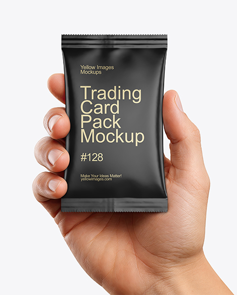 Matte Trading Card Pack in a Hand Mockup - PSD Mockups