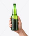 Green Glass Beer Bottle in a Hand Mockup