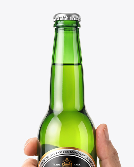 Green Glass Beer Bottle in a Hand Mockup